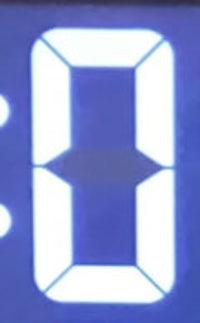 a blue led display showing the number 0