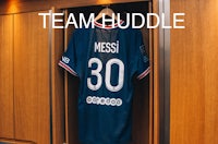 a soccer jersey hangs in a closet with the words team buddy